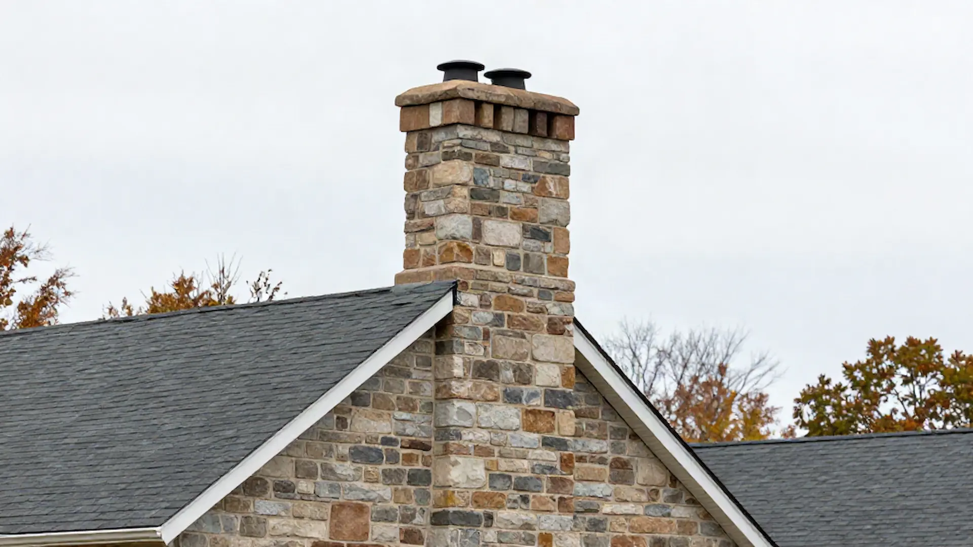 Brick chimney on a home served by Strickland & Crawford Chimney Repair Inc. in Philadelphia, PA